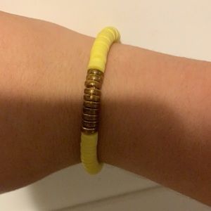 I’m selling a yellow clay bead bracelet